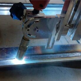 DynaSwing 100K magnetic oscillating welding carriage front view with magnetic rail