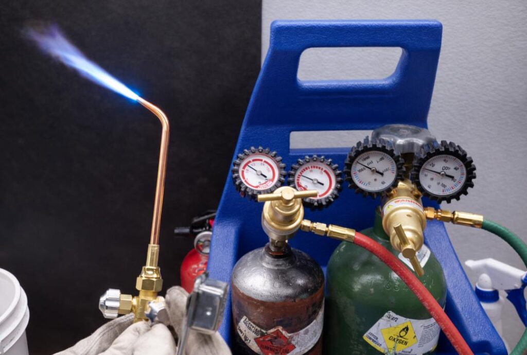 Welding flame set to neutral flame for oxy fuel welding