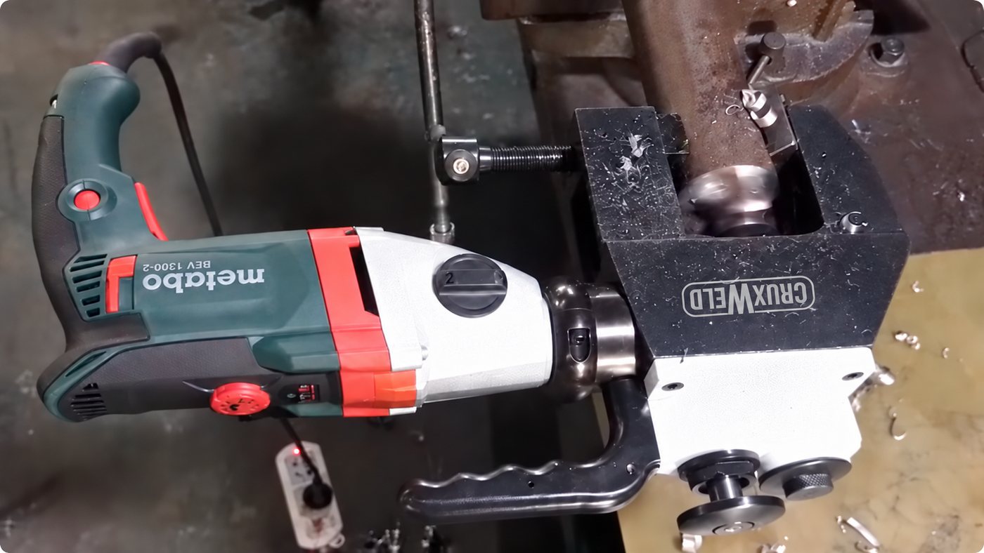 BEVEX 63 pipe beveling machine cutting a bevel on a pipe end with metal chips