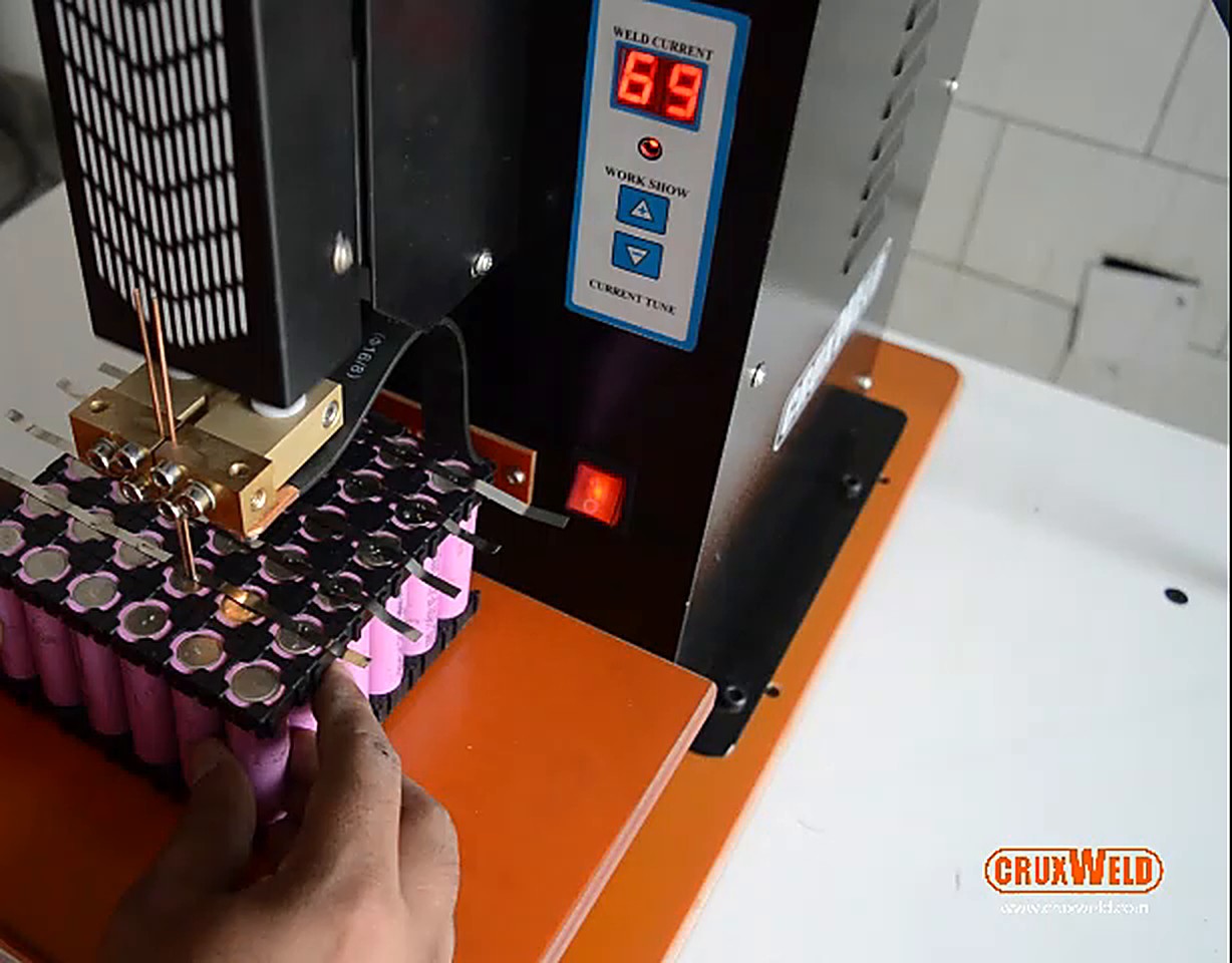 Operator welding nickel strip on an 18650 pack with the CBS10P pneumatic battery spot welding machine
