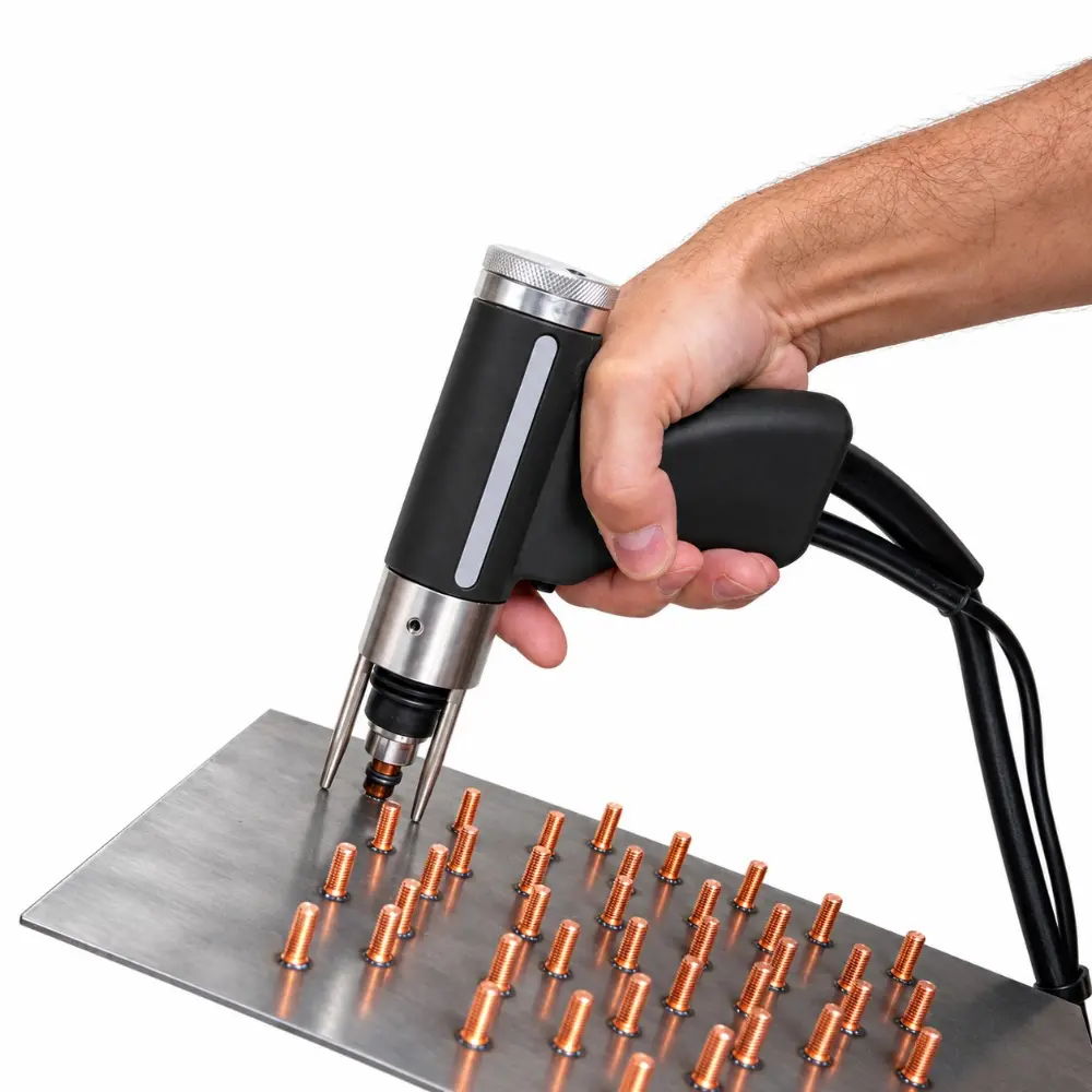 CD stud welding gun welding a grid of studs onto a stainless steel sheet