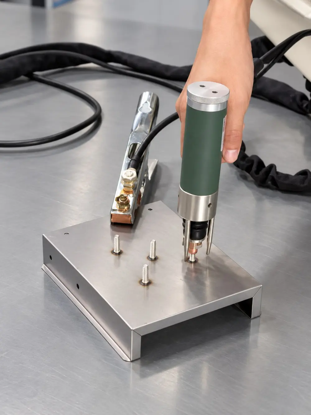 CDS10M tube gun welding studs on a stainless steel bracket