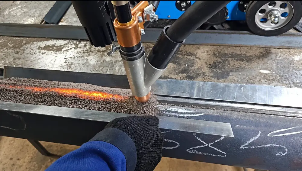 Submerged arc welding seam glowing under the flux blanket