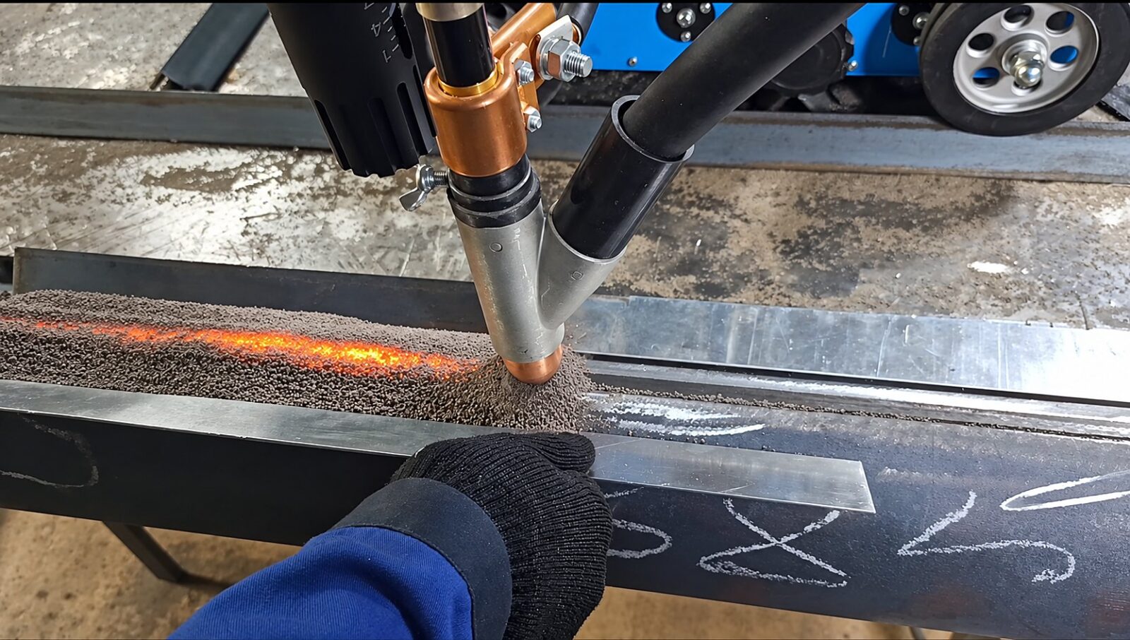 Submerged arc welding seam glowing under the flux blanket